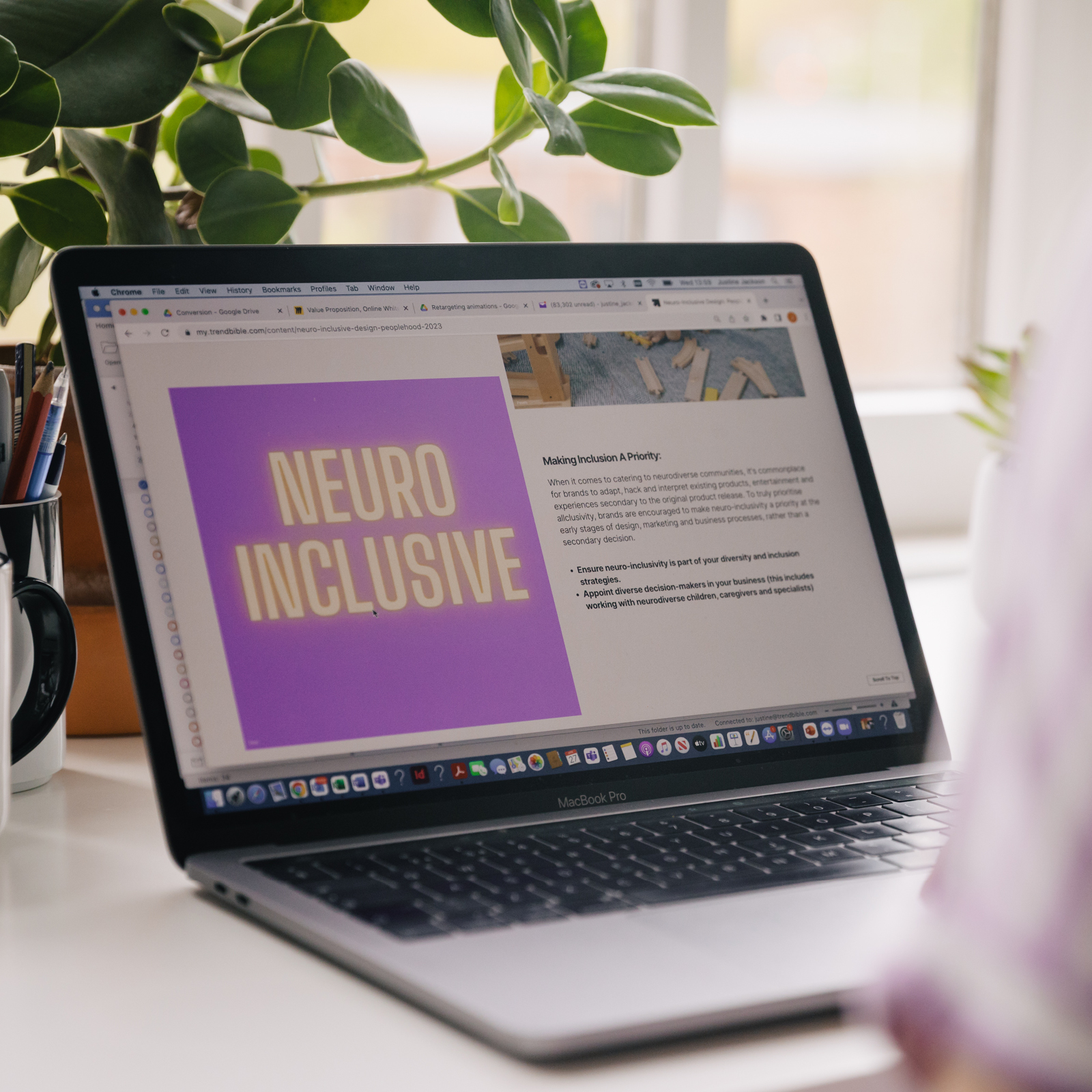 Image of a macbook with a trend report open on screen about Inclusion